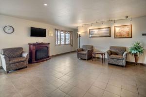 a living room filled with furniture and a fire place at Quality Inn Kenai in Kenai