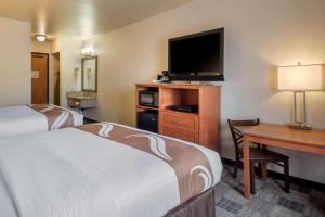 a hotel room with two beds and a television at Quality Inn Kenai in Kenai