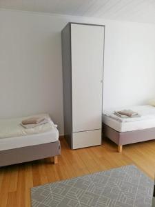 מיטה או מיטות בחדר ב-Ferienwohnung Mammut 1