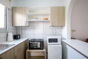 A kitchen or kitchenette at Pandream Hotel Apartments