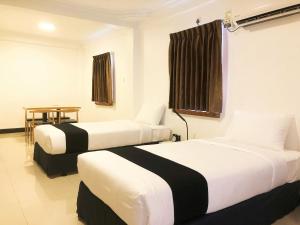 Katil atau katil-katil dalam bilik di K.C Hotel