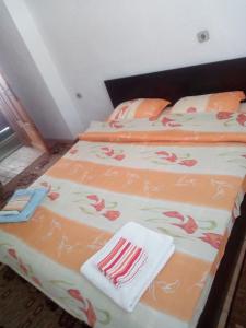 Cama ou camas em um quarto em Guest House Jani