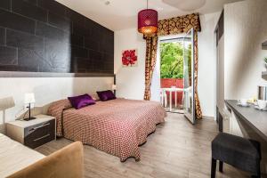 Postel nebo postele na pokoji v ubytování Hotel Vienna