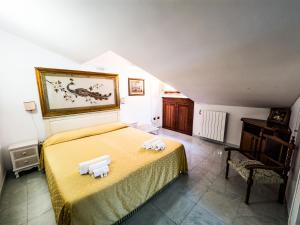 Postel nebo postele na pokoji v ubytování Euro Hotel Iglesias