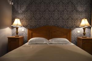 Ένα ή περισσότερα κρεβάτια σε δωμάτιο στο Hotel Brigitte