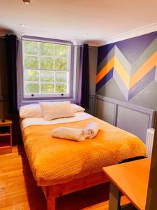 Postel nebo postele na pokoji v ubytování KX Rooms Kings Cross