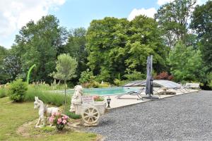 a boat with a statue of a horse pulling a cart at Château de broyes in Broyes +6 photos