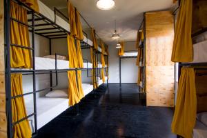 a corridor of bunk beds in a hostel at Karma Hostel in Martvili