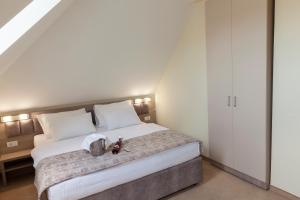 Postel nebo postele na pokoji v ubytování Hotel Livade