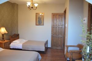 Ένα ή περισσότερα κρεβάτια σε δωμάτιο στο Hotel Brigitte
