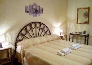 Ένα ή περισσότερα κρεβάτια σε δωμάτιο στο Casa Vacanza nell'Orto