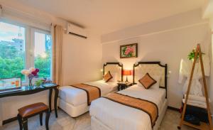 Postel nebo postele na pokoji v ubytování Bellevue Hotel