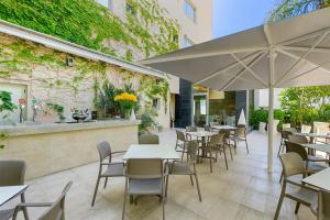 מסעדה או מקום אחר לאכול בו ב-Hotel Areca