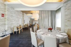 מסעדה או מקום אחר לאכול בו ב-Hotel Areca