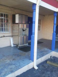 a large metal appliance sitting inside of a building at Deluxe Inn Austin in Austin