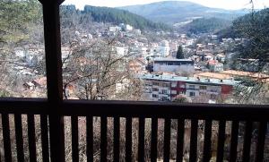 a view of a city from a window at Трънската къща in Trŭn