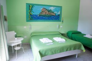 Un pat sau paturi într-o cameră la B&B Le isole