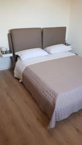 A bed or beds in a room at Casa Sigiu - Il Fiume