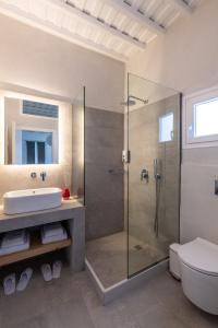 a bathroom with a shower and a sink at Gazia Sea View House - Mykonos Town in Mýkonos City