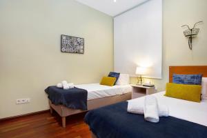 Llit o llits en una habitació de Stay U-nique Apartments Provença II