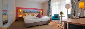Postel nebo postele na pokoji v ubytování Hotel Kreuzer