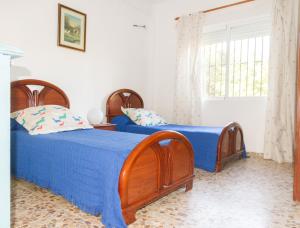 Postel nebo postele na pokoji v ubytování Fantástico chalet con piscina en Avenida del Brillante + 18 fotografií