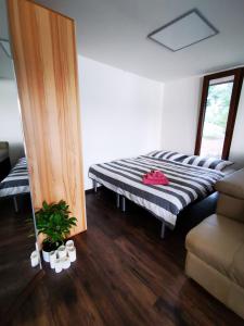 A bed or beds in a room at Golden Beach Apartment