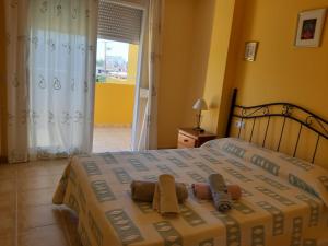Posteľ alebo postele v izbe v ubytovaní Urbanización Sueños de Denia II apto 2 habitaciones + 10 fotografií
