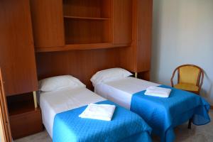 Postel nebo postele na pokoji v ubytování Castelvetere Hotel