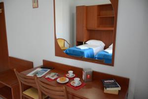 Postel nebo postele na pokoji v ubytování Castelvetere Hotel