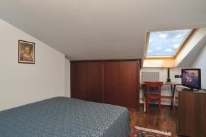 Postel nebo postele na pokoji v ubytování Hotel Bonconte