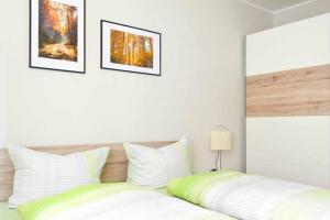 Postel nebo postele na pokoji v ubytování Ferienwohnung In der Altstadt