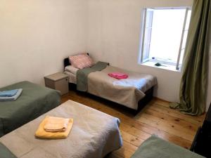 Letto o letti in una camera di Guesthaus King Seti