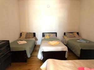Letto o letti in una camera di Guesthaus King Seti