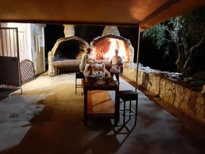 two people standing in front of a fire oven at Mafrolla Carlo in Vieste
