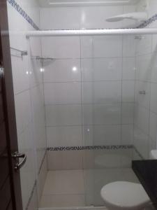 a bathroom with a shower with a toilet at Imóvel na Beira-Mar in Pipa +50 photos