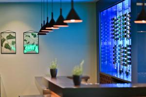 a dining room with wine racks and a table at Botanique Hotel Prague in Prague