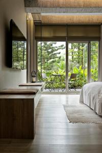Letto o letti in una camera di JBG Hotspring Resort Hotel