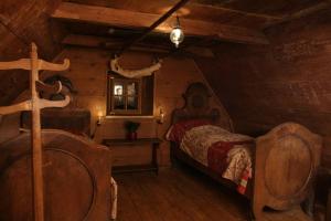 Rúm í herbergi á Chalet Hinterbreiteneben