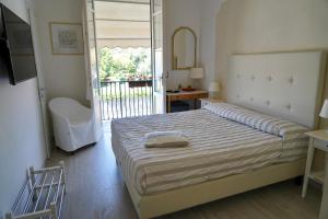 Postel nebo postele na pokoji v ubytování Hotel La Primula