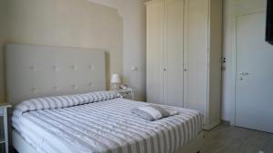 Postel nebo postele na pokoji v ubytování Hotel La Primula