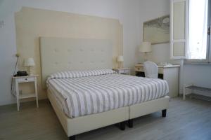 Postel nebo postele na pokoji v ubytování Hotel La Primula