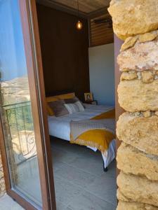 Кровать или кровати в номере The Loft Gozo