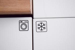 a refrigerator with a picture of a snowflake on it at VOYA Apartments - a luxury oasis in the old town in Braşov
