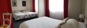 Postel nebo postele na pokoji v ubytování Hotel Pyrenées Atlantique