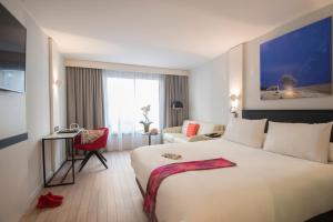 Postel nebo postele na pokoji v ubytování Mercure Ajaccio