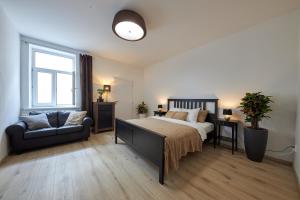A bed or beds in a room at Le Monde Apartment Bratislava - amazing 5BDR in downtown