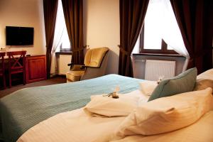 Posteľ alebo postele v izbe v ubytovaní Hotel Pod Orłem