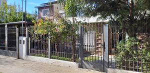 a metal gate in front of a house at Ignacio Garzón Departamento in Córdoba