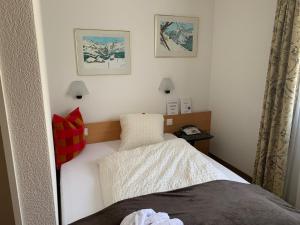 Postel nebo postele na pokoji v ubytování Hotel Belmont